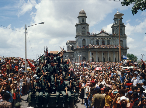 Entering the central plaza in Managua to celebrate victory, Nicaragua, July 20, 1979