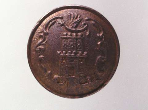 The gilded button featuring the Ljubljana coat-of-arms