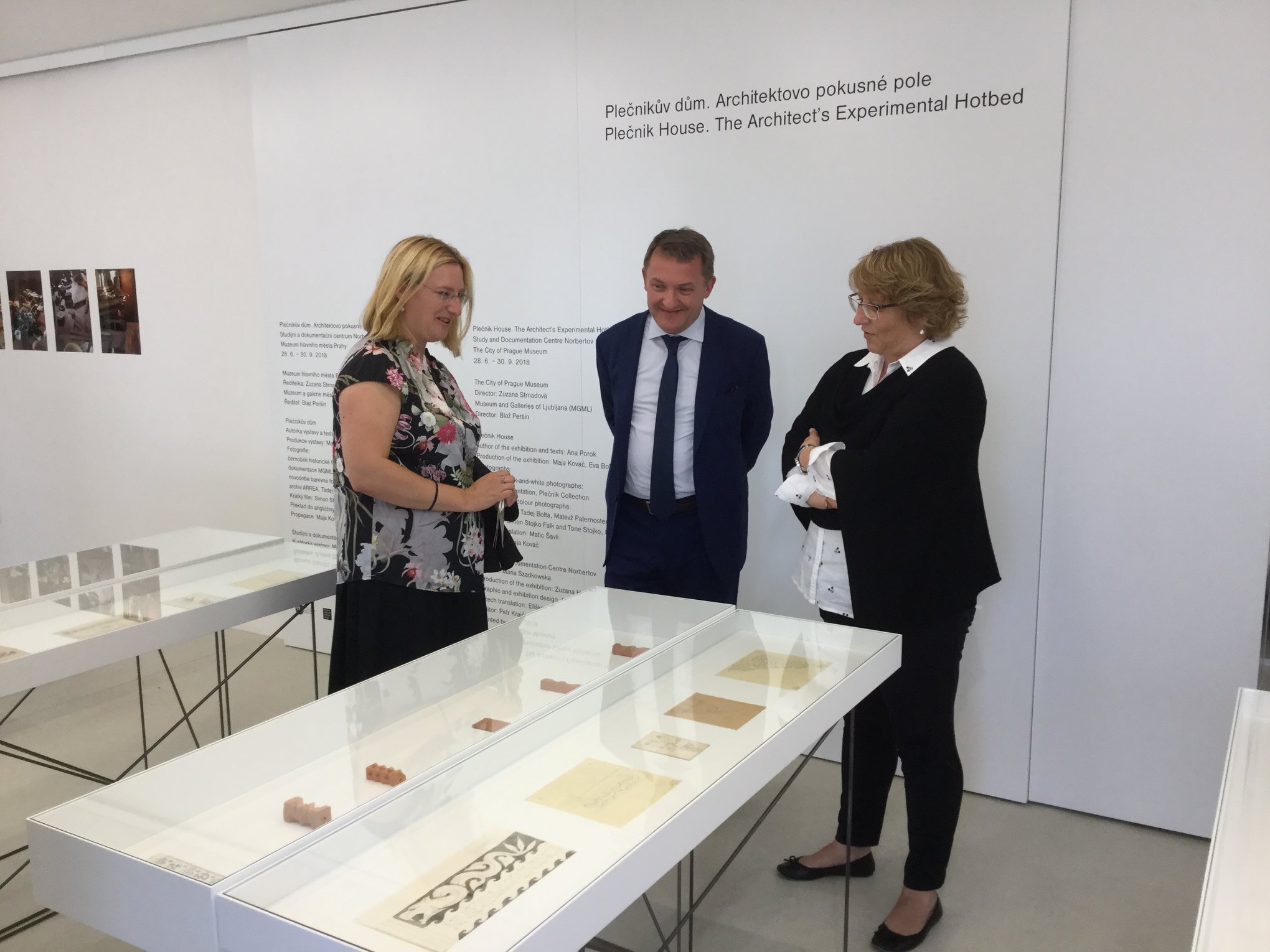 Ana Porok, curator, Leon Marc, Slovenian ambassador, and Irena Vesel, conservator, at the exhibition opening in the Norbertov Centre